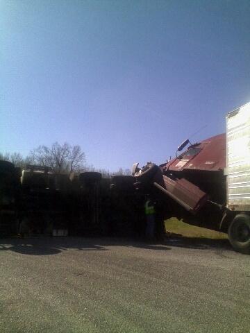 Truck landed on a dump truck